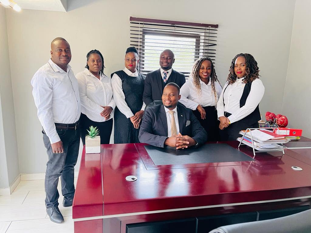The Malada M Attorneys team in their office